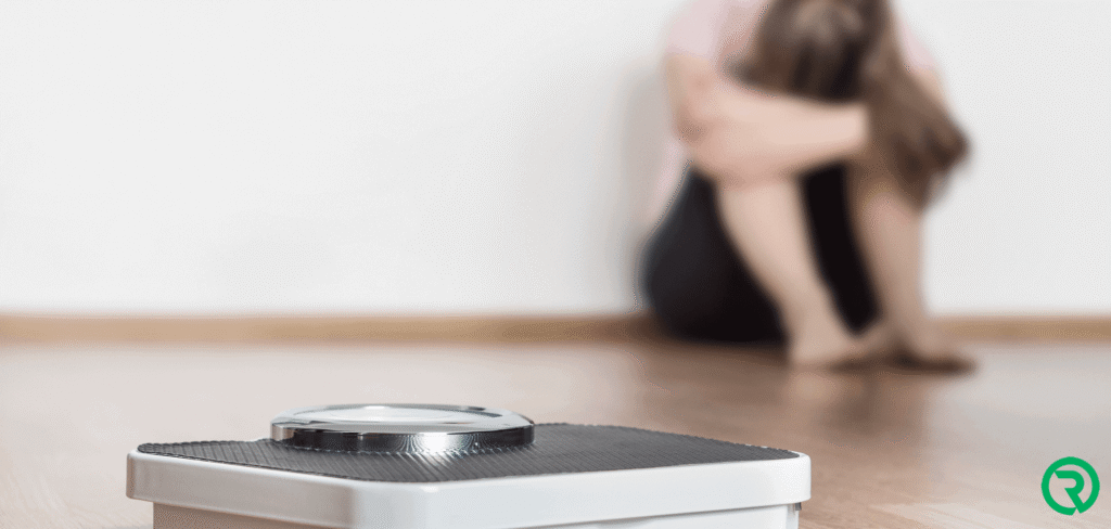 Verdrietig door het getal op de weegschaal